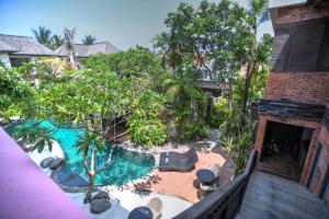 an overhead view of a backyard with a swimming pool at Melo Suites Hotel in Seminyak
