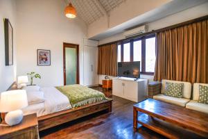 Postel nebo postele na pokoji v ubytování Melo Suites Hotel