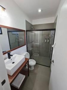 a bathroom with a sink and a toilet and a shower at Urban Justo Sierra in Guadalajara