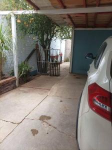 a car parked in a garage next to a driveway at casa de mamá in Santa María Azompa