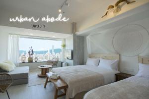 Postel nebo postele na pokoji v ubytování 所在行旅2館-渡咕所在 UrbanAbode2-DUGU