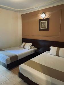 - une chambre d'hôtel avec 2 lits dans l'établissement A'Famosa Villas, à Ayer Keroh