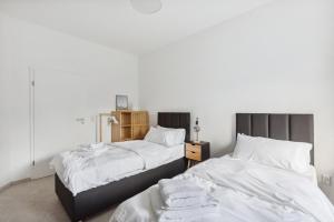 Postel nebo postele na pokoji v ubytování MARLEI 6 Apartment mit 3 Schlafzimmern, gemütlichen Wohnbereich, mit 2 WCs