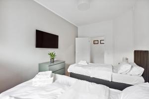 Postel nebo postele na pokoji v ubytování MARLEI 6 Apartment mit 3 Schlafzimmern, gemütlichen Wohnbereich, mit 2 WCs