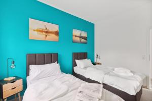Postel nebo postele na pokoji v ubytování MARLEI 6 Apartment mit 3 Schlafzimmern, gemütlichen Wohnbereich, mit 2 WCs