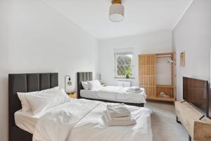 Postel nebo postele na pokoji v ubytování MARLEI 6 Apartment mit 3 Schlafzimmern, gemütlichen Wohnbereich, mit 2 WCs