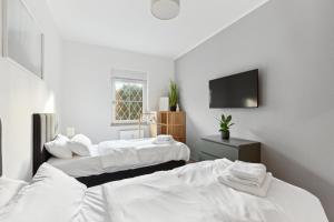 Postel nebo postele na pokoji v ubytování MARLEI 6 Apartment mit 3 Schlafzimmern, gemütlichen Wohnbereich, mit 2 WCs