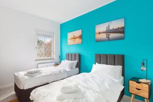 Postel nebo postele na pokoji v ubytování MARLEI 6 Apartment mit 3 Schlafzimmern, gemütlichen Wohnbereich, mit 2 WCs
