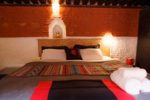 Letto o letti in una camera di Hira Guest House