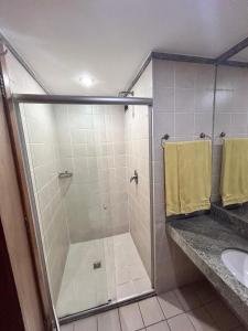 a bathroom with a shower and a sink at 705. Flat hotel Go Inn in Brasília