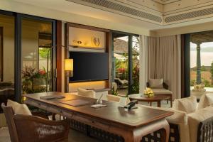 a living room with a table and chairs at Jumeirah Bali in Uluwatu
