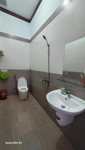 a bathroom with a sink and a toilet at Lak View hotel in Lien Son