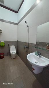 a bathroom with a sink and a toilet at Lak View hotel in Lien Son +34 photos