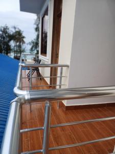 a metal railing on the balcony of a house at Jodari Hotel Nungwi in Nungwi