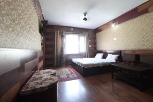 Ένα ή περισσότερα κρεβάτια σε δωμάτιο στο Hotel O Gulfam Palace +24 φωτογραφίες