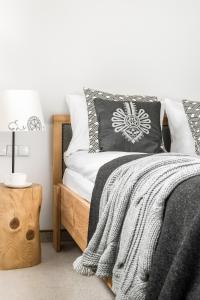 Posteľ alebo postele v izbe v ubytovaní Villa 11 Folk & Design