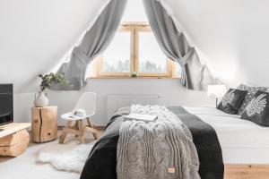 Posteľ alebo postele v izbe v ubytovaní Villa 11 Folk & Design