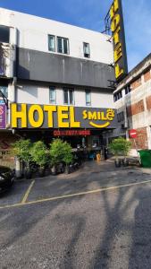 a hotel with a sign on the side of a building at Smile Hotel Petaling Jaya SS2 in Petaling Jaya