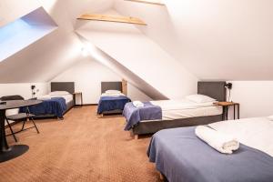 Posteľ alebo postele v izbe v ubytovaní Pirat Hotel & SPA-hotel z basenem