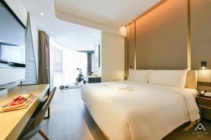 Postel nebo postele na pokoji v ubytování Atour Hotel Wangjing SOHO