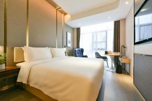 Postel nebo postele na pokoji v ubytování Atour Hotel Wangjing SOHO