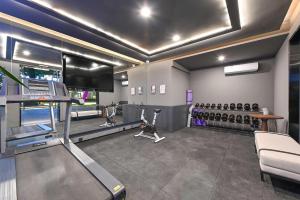 a gym with a treadmill and several exercise bikes at Atour Hotel Beijing Drum Tower in Beijing