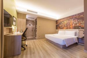 Postel nebo postele na pokoji v ubytování Atour Hotel Xujiahui Meiying