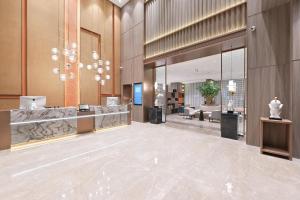 a lobby of a hotel with a waiting area at Atour Hotel Beijing North Chaoyang Road Changyingtian Street in Beijing
