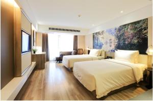 Cama o camas de una habitación en Atour Hotel Xi'an Xixian Vientiane City