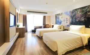 Cama o camas de una habitación en Atour Hotel Xi'an Xixian Vientiane City