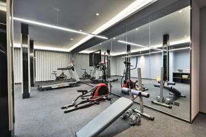 a gym with several treadmills and exercise bikes at Atour Hotel Kunming Dianchi Park 1903 in Kunming +10 photos