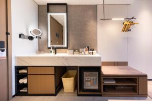 a bathroom with a sink and a mirror at Atour Hotel Beijing Beiqing Road Yongfeng Science and Technology Park in Beijing