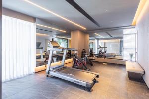 a gym with several exercise equipment in a room at Atour Hotel Kunming Xiaokang Avenue in Kunming
