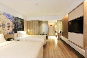Cama o camas de una habitación en Atour Hotel Xi'an Xixian Vientiane City
