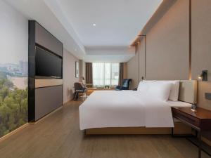 TV a/nebo společenská místnost v ubytování Atour Hotel Foshan Shunde Happy Coast