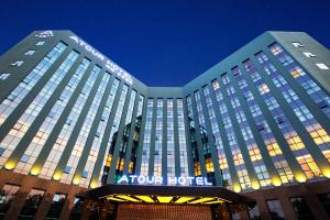 a large hotel building with a lot of windows at Atour Hotel Bantian Zhongcheng Shenzhen in Longgang