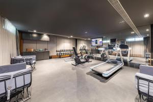 a gym with treadmills and machines in a room at Atour X Hotel Beijing Yonghe Temple Hepingli in Beijing