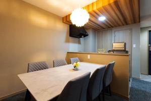 a conference room with a table and chairs at GANADAN天文館 in Kagoshima