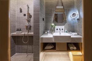 a bathroom with a sink and a shower at Atour Hotel Chengdu Chunxi Road Tianfu Square Subway Station in Chengdu