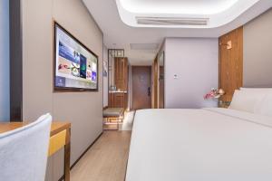 Letto o letti in una camera di Atour X Hotel Beijing Yonghe Temple Hepingli