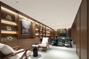 a waiting room with a table and chairs at Atour Hotel Shanghai Lujiazui South Pudong Road in Shanghai