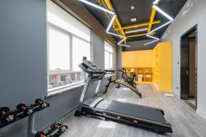 a gym with a treadmill and bikes in a room at Atour Hotel Hangzhou Zhuantang Songcheng Academy of Fine Arts in Hangzhou +33 photos