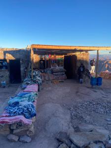 a room with a group of blankets in a building at Mount Moses Camp in Saint Catherine