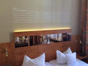 Postel nebo postele na pokoji v ubytování Hotel Barbara