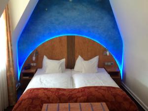 Postel nebo postele na pokoji v ubytování Hotel Barbara