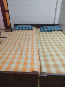 Postel nebo postele na pokoji v ubytování G R MANSION
