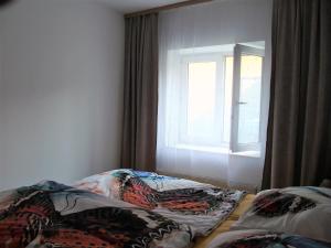 Postel nebo postele na pokoji v ubytování Apartmány U Krumlova
