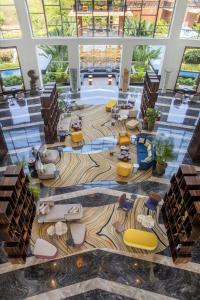 an image of a lobby with chairs and tables at The Westin Goa, Anjuna in Anjuna