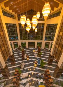 an empty lobby with chandeliers in a building at The Westin Goa, Anjuna in Anjuna