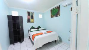 מיטה או מיטות בחדר ב-Homestay Simply Homy dekat Tugu Jogja dan Monjali